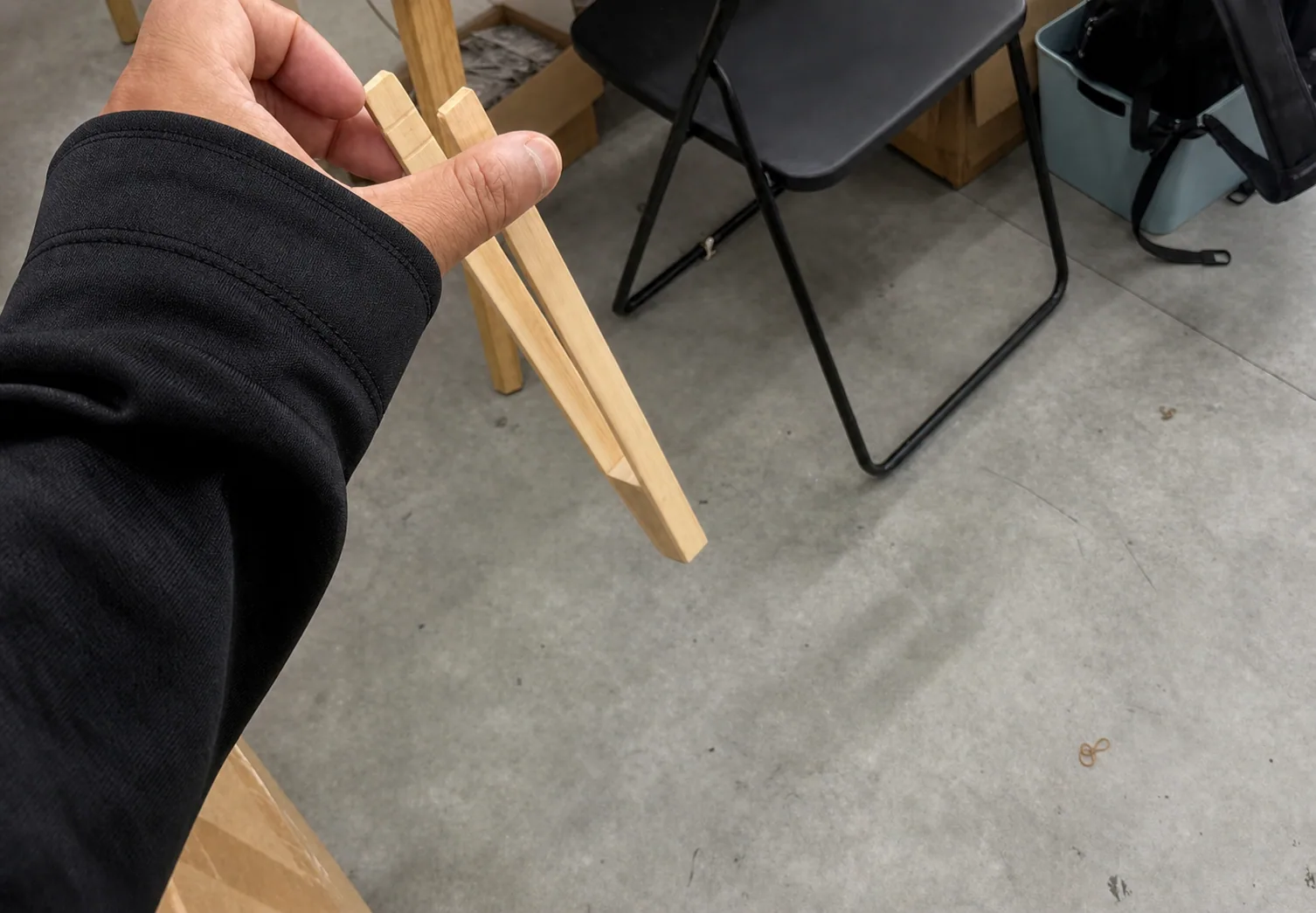 Representative scene of a person handling a product fixture during a practical check
