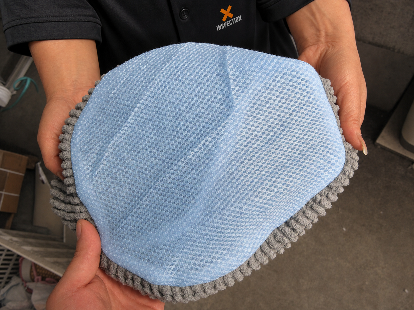 An X Inspection inspector checking product presentation during a custom order inspection